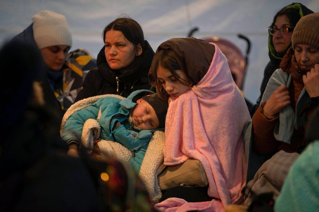 Ukrainian refugees rest in a tent after crossing the border into Medyka, Poland on March 6.