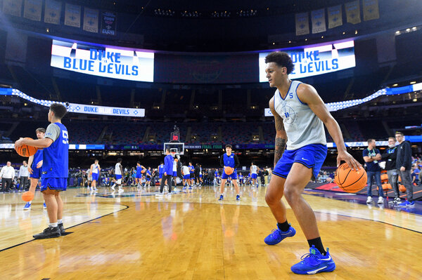 Duke forward Paolo Banchero dribbling during a practice on Friday ahead of his team's matchup on Saturday night against North Carolina in the Final Four.